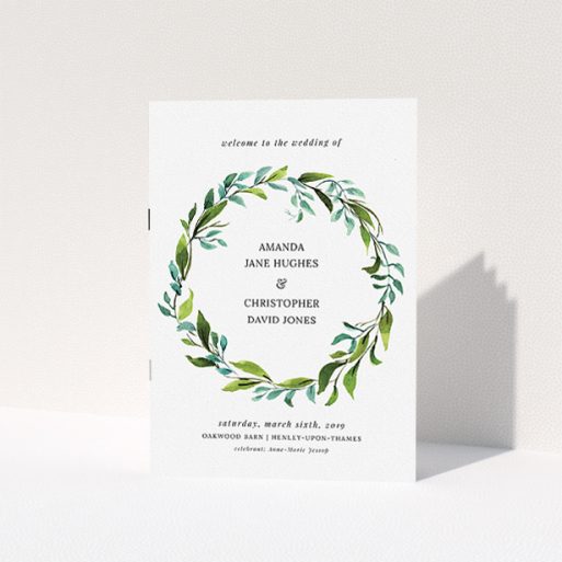 Wedding Order Of Service Design - "Watercolour Wreath Cover" A wedding order of service design named "Watercolour Wreath Cover". It is an A5 booklet in a portrait orientation. "Watercolour Wreath Cover" is available as a folded booklet booklet, with tones of green and light blue.