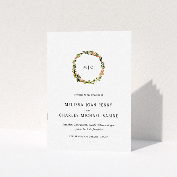 A wedding program named "Floral Monogram". It is an A5 booklet in a portrait orientation. "Floral Monogram" is available as a folded booklet booklet, with tones of white and Orange.
