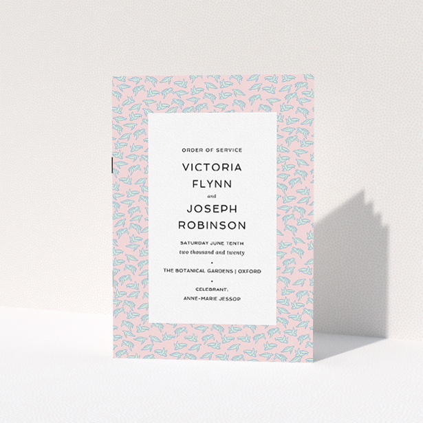 A wedding program design named "Tiny, Tiny Turtles". It is an A5 booklet in a portrait orientation. "Tiny, Tiny Turtles" is available as a folded booklet booklet, with tones of blue and pink.