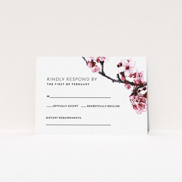 A wedding response card design called "A side of Blossom". It is an A7 card in a landscape orientation. "A side of Blossom" is available as a flat card, with tones of pink and white.