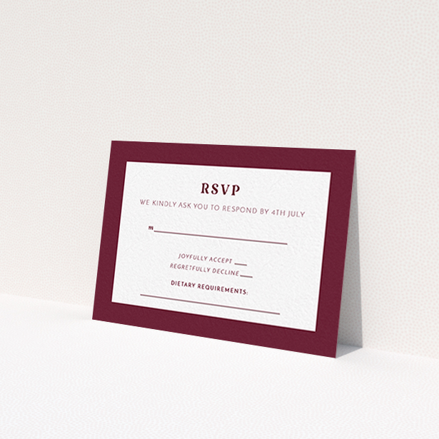 A wedding response card design called "Bold border". It is an A7 card in a landscape orientation. "Bold border" is available as a flat card, with tones of burgundy and white.