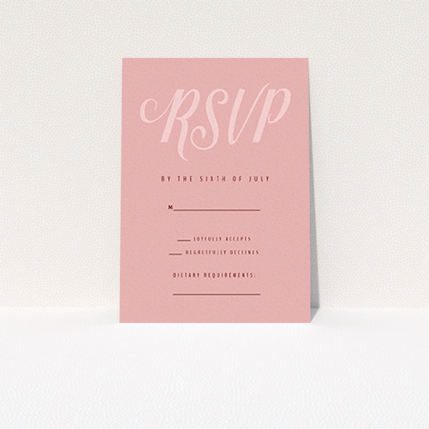A wedding rsvp card design called "Slant Typography Pastel pink". It is an A7 card in a portrait orientation. "Slant Typography Pastel pink" is available as a flat card, with mainly pink colouring.