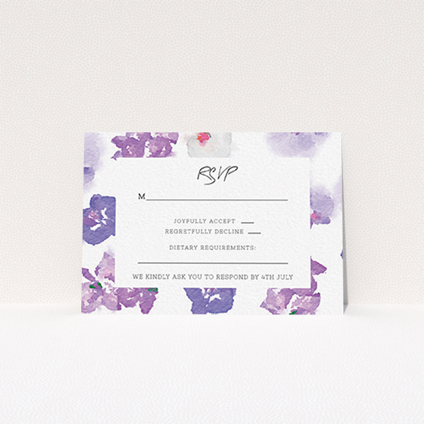 A wedding rsvp card named "Violet Explosion". It is an A7 card in a landscape orientation. "Violet Explosion" is available as a flat card, with mainly purple/dark pink colouring.
