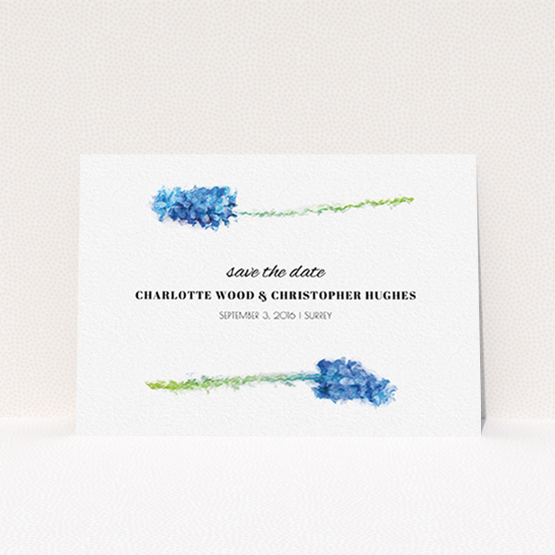 A wedding save the date card called "A new bloom". It is an A6 card in a landscape orientation. "A new bloom" is available as a flat card, with tones of blue and white.