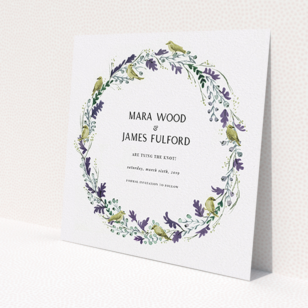 A wedding save the date card design titled "Birdsong". It is a square (148mm x 148mm) card in a square orientation. "Birdsong" is available as a flat card, with tones of off-white and dark green.