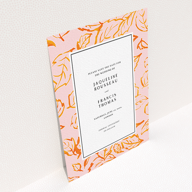 A wedding save the date card template titled "Falling Foliage". It is an A6 card in a portrait orientation. "Falling Foliage" is available as a flat card, with tones of pink and orange.