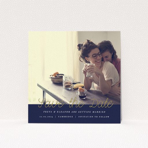 Wedding Save The Date Card Design - "Gold on Navy Blue" A wedding save the date card template titled "Gold on Navy Blue". It is a square (148mm x 148mm) card in a square orientation. It is a photographic wedding save the date card with room for 1 photo. "Gold on Navy Blue" is available as a flat card, with tones of navy blue and white.