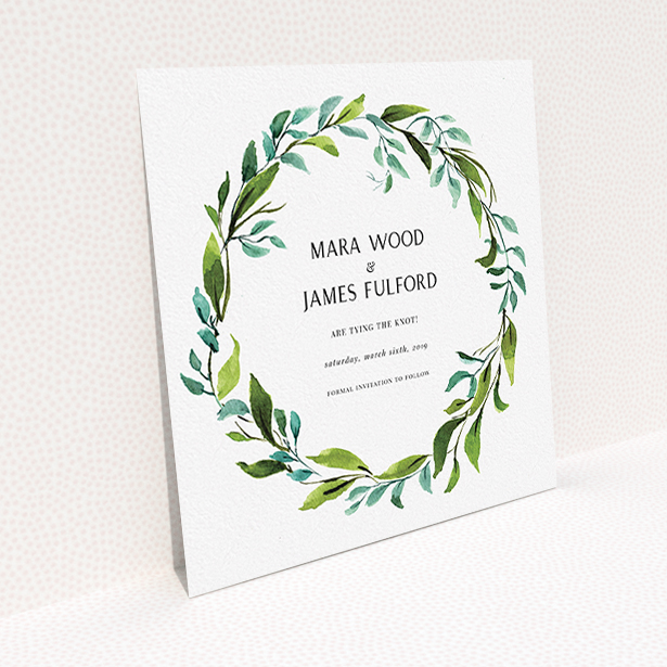 A wedding save the date card design named "Greek Wreath". It is a square (148mm x 148mm) card in a square orientation. "Greek Wreath" is available as a flat card, with tones of blue and green.
