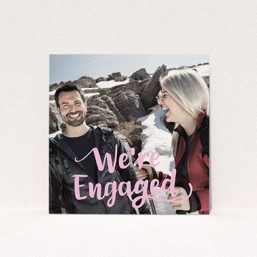 Wedding Save The Date Card Design - "Lively Typography" A wedding save the date card design called "Lively Typography". It is a square (148mm x 148mm) card in a square orientation. It is a photographic wedding save the date card with room for 1 photo. "Lively Typography" is available as a flat card, with mainly light pink colouring.