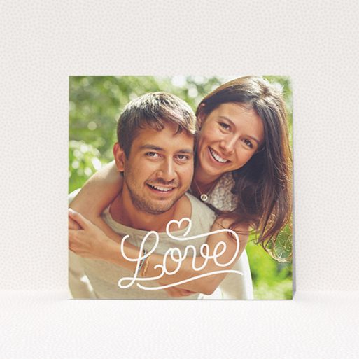 Wedding Save The Date Card Design - "Love of Typography Photo" A wedding save the date card design titled "Love of Typography Photo". It is a square (148mm x 148mm) card in a square orientation. It is a photographic wedding save the date card with room for 1 photo. "Love of Typography Photo" is available as a flat card, with mainly white colouring.