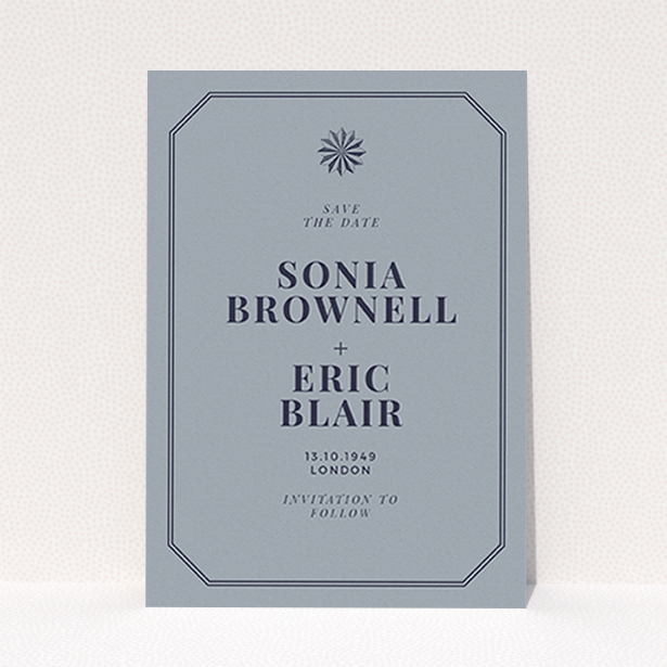 A wedding save the date card template titled "Shaded sundial". It is an A6 card in a portrait orientation. "Shaded sundial" is available as a flat card, with tones of dark grey and navy blue.