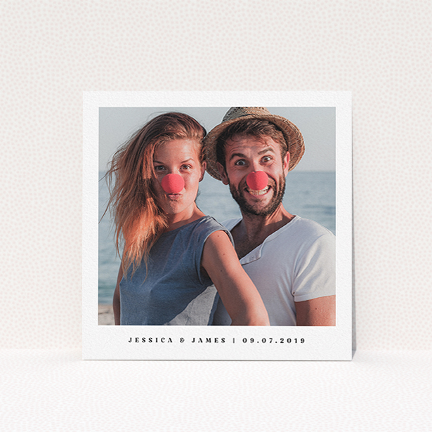 A wedding save the date card named "Simple Save". It is a square (148mm x 148mm) card in a square orientation. It is a photographic wedding save the date card with room for 1 photo. "Simple Save" is available as a flat card, with mainly white colouring.