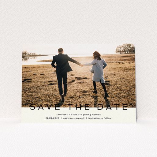 Wedding Save The Date Card Design - "Simple Saving" A wedding save the date card called "Simple Saving". It is an A5 card in a landscape orientation. It is a photographic wedding save the date card with room for 1 photo. "Simple Saving" is available as a flat card, with tones of cream and black.