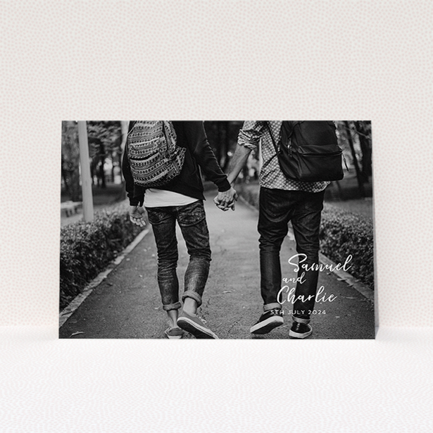 A wedding save the date card template titled "Soho Script". It is an A5 card in a landscape orientation. It is a photographic wedding save the date card with room for 1 photo. "Soho Script" is available as a flat card, with mainly white colouring.