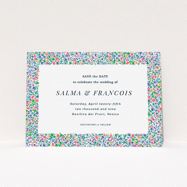 A wedding save the date card called "The faraway garden". It is an A6 card in a landscape orientation. "The faraway garden" is available as a flat card, with tones of white, blue and green.