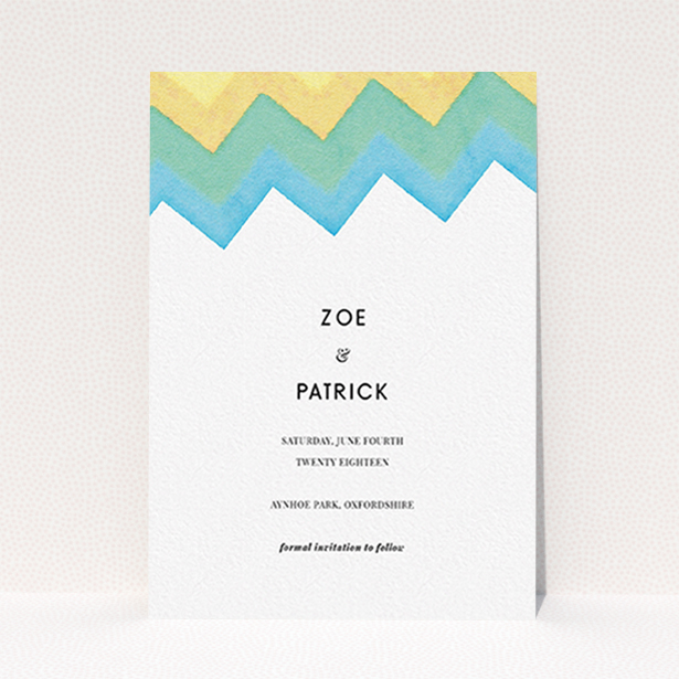 A wedding save the date card design named "Vibrant Peaks". It is an A6 card in a portrait orientation. "Vibrant Peaks" is available as a flat card, with tones of white, blue and green.