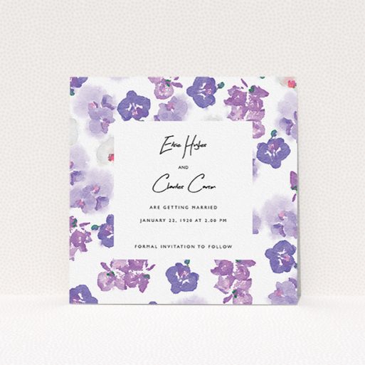 Wedding Save The Date Card Design - "Violet Explosion" A wedding save the date card design named "Violet Explosion". It is a square (148mm x 148mm) card in a square orientation. "Violet Explosion" is available as a flat card, with mainly purple/dark pink colouring.