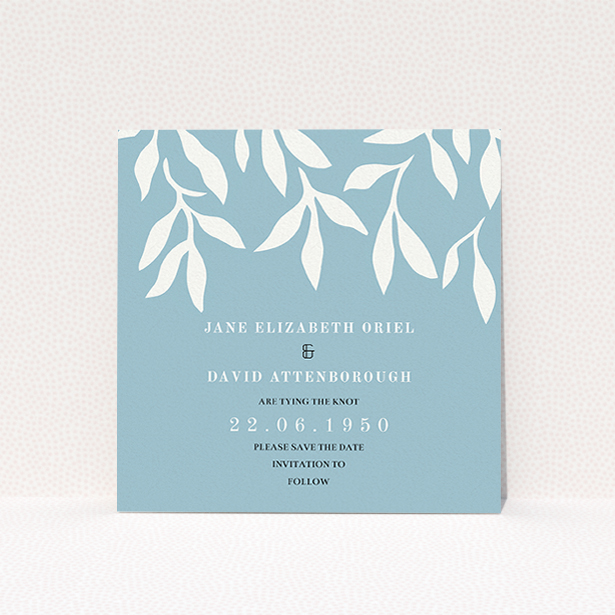 A wedding save the date card named "Winter bloom". It is a square (148mm x 148mm) card in a square orientation. "Winter bloom" is available as a flat card, with tones of blue and white.