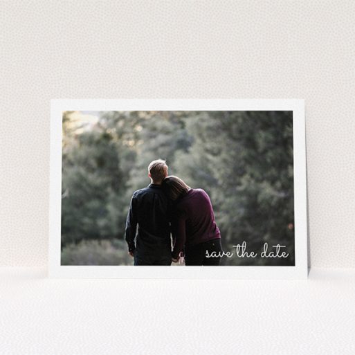 Wedding Save The Date Design - "Date Saving Photo" A wedding save the date template titled "Date Saving Photo". It is an A5 save the date in a landscape orientation. It is a photographic wedding save the date with room for 1 photo. "Date Saving Photo" is available as a flat save the date, with mainly white colouring.