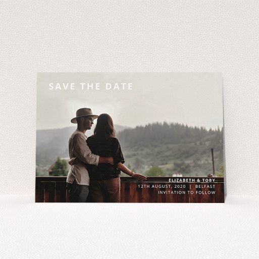 Wedding Save The Date Design - "Sans Serif" A wedding save the date design called "Sans Serif". It is an A5 save the date in a landscape orientation. It is a photographic wedding save the date with room for 1 photo. "Sans Serif" is available as a flat save the date, with mainly white colouring.