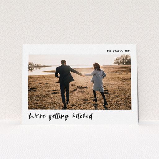 Wedding Save The Date Design - "Top and Bottom Photo" A wedding save the date design called "Top and Bottom Photo". It is an A5 save the date in a landscape orientation. It is a photographic wedding save the date with room for 1 photo. "Top and Bottom Photo" is available as a flat save the date, with mainly white colouring.