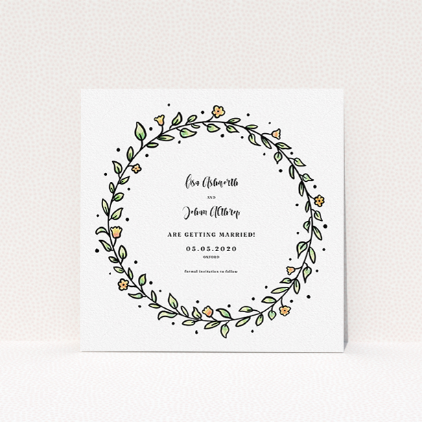 A wedding save the date template titled "Wreath Outline". It is a square (148mm x 148mm) save the date in a square orientation. "Wreath Outline" is available as a flat save the date, with tones of light green and orange.
