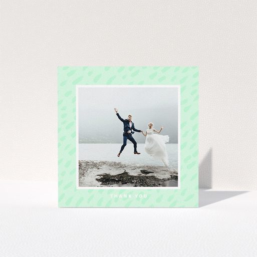 Wedding Thank You Card Design - "A symphony in green" A wedding thank you card design named "A symphony in green". It is a square (148mm x 148mm) card in a square orientation. It is a photographic wedding thank you card with room for 1 photo. "A symphony in green" is available as a folded card, with tones of green and white.