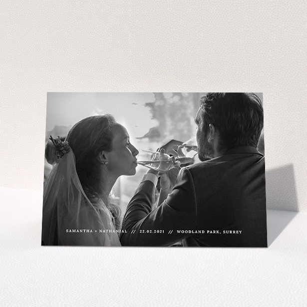 A wedding thank you card design called "Along the bottom". It is an A5 card in a landscape orientation. It is a photographic wedding thank you card with room for 1 photo. "Along the bottom" is available as a folded card, with mainly white colouring.