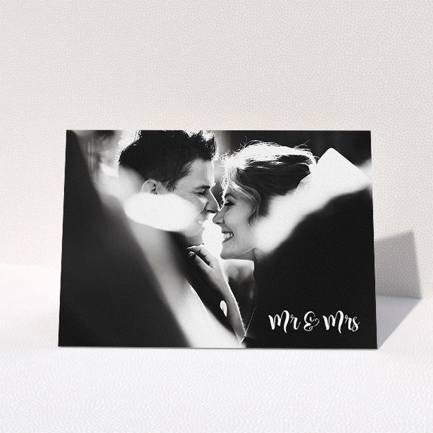 A wedding thank you card called "Black and White". It is an A5 card in a landscape orientation. It is a photographic wedding thank you card with room for 1 photo. "Black and White" is available as a folded card, with mainly white colouring.