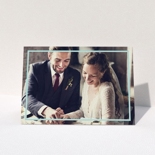 Wedding Thank You Card Design - "Blue White Photo Frame" A wedding thank you card called "Blue White Photo Frame". It is an A5 card in a landscape orientation. It is a photographic wedding thank you card with room for 1 photo. "Blue White Photo Frame" is available as a folded card, with mainly blue colouring.