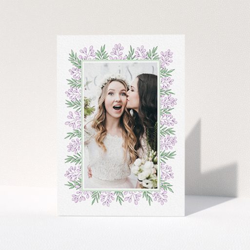 Wedding Thank You Card Design - "Floral Thank You Card" A wedding thank you card called "Floral Thank You Card". It is an A6 card in a portrait orientation. It is a photographic wedding thank you card with room for 1 photo. "Floral Thank You Card" is available as a folded card, with tones of purple and green.