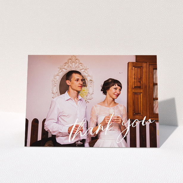 A wedding thank you card design titled "Handwritten Thanks". It is an A5 card in a landscape orientation. It is a photographic wedding thank you card with room for 1 photo. "Handwritten Thanks" is available as a folded card, with mainly white colouring.