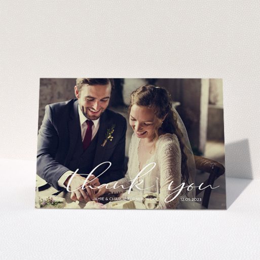 Wedding Thank You Card Design - "Handwritten Thanks" A wedding thank you card design called "Handwritten Thanks". It is an A5 card in a landscape orientation. It is a photographic wedding thank you card with room for 1 photo. "Handwritten Thanks" is available as a folded card, with mainly white colouring.