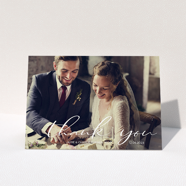A wedding thank you card design called "Handwritten Thanks". It is an A5 card in a landscape orientation. It is a photographic wedding thank you card with room for 1 photo. "Handwritten Thanks" is available as a folded card, with mainly white colouring.