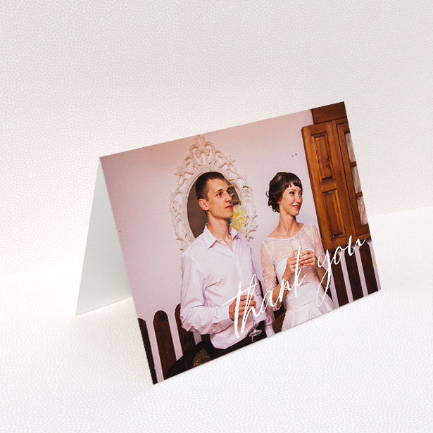 A wedding thank you card design titled "Handwritten Thanks". It is an A5 card in a landscape orientation. It is a photographic wedding thank you card with room for 1 photo. "Handwritten Thanks" is available as a folded card, with mainly white colouring.