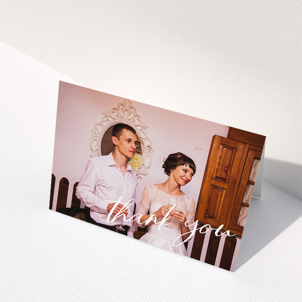 A wedding thank you card design titled "Handwritten Thanks". It is an A5 card in a landscape orientation. It is a photographic wedding thank you card with room for 1 photo. "Handwritten Thanks" is available as a folded card, with mainly white colouring.
