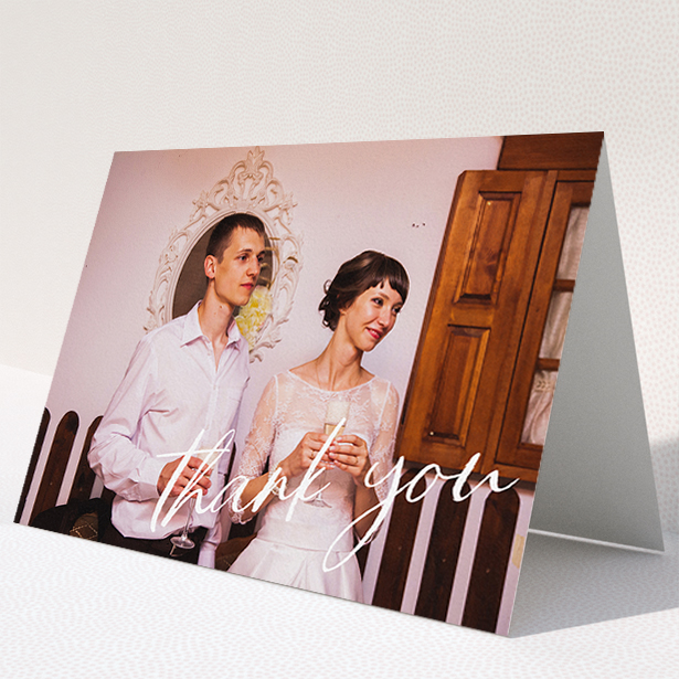 A wedding thank you card design titled "Handwritten Thanks". It is an A5 card in a landscape orientation. It is a photographic wedding thank you card with room for 1 photo. "Handwritten Thanks" is available as a folded card, with mainly white colouring.