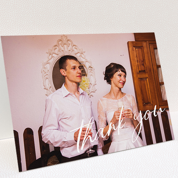 A wedding thank you card design titled "Handwritten Thanks". It is an A5 card in a landscape orientation. It is a photographic wedding thank you card with room for 1 photo. "Handwritten Thanks" is available as a folded card, with mainly white colouring.
