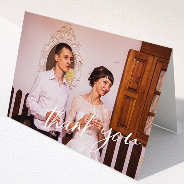 A wedding thank you card design titled "Handwritten Thanks". It is an A5 card in a landscape orientation. It is a photographic wedding thank you card with room for 1 photo. "Handwritten Thanks" is available as a folded card, with mainly white colouring.