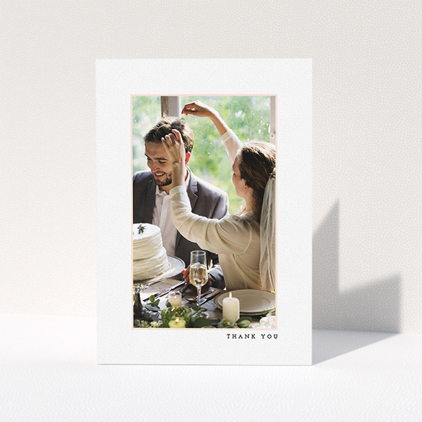 A wedding thank you card template titled "Little pink border". It is an A5 card in a portrait orientation. It is a photographic wedding thank you card with room for 1 photo. "Little pink border" is available as a folded card, with mainly white colouring.