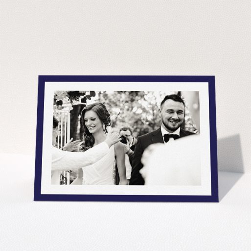 Wedding Thank You Card Design - "Navy Border" A wedding thank you card named "Navy Border". It is an A5 card in a landscape orientation. It is a photographic wedding thank you card with room for 1 photo. "Navy Border" is available as a folded card, with tones of blue and white.