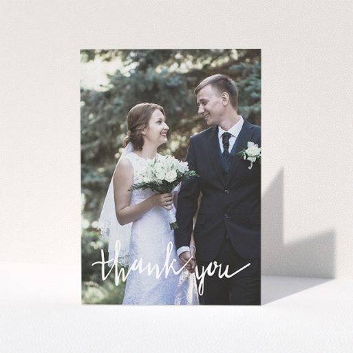 Wedding Thank You Card Design - "New to calligraphy" A wedding thank you card called "New to calligraphy". It is an A5 card in a portrait orientation. It is a photographic wedding thank you card with room for 1 photo. "New to calligraphy" is available as a folded card, with mainly white colouring.