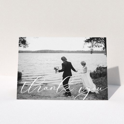 Wedding Thank You Card Design - "One Photo" A wedding thank you card template titled "One Photo". It is an A5 card in a landscape orientation. It is a photographic wedding thank you card with room for 1 photo. "One Photo" is available as a folded card, with mainly white colouring.