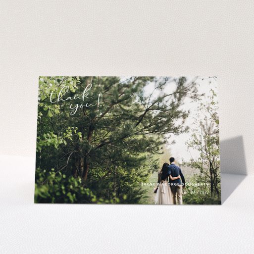 Wedding Thank You Card Design - "Opposite Photo Corners" A wedding thank you card design called "Opposite Photo Corners". It is an A5 card in a landscape orientation. It is a photographic wedding thank you card with room for 1 photo. "Opposite Photo Corners" is available as a folded card, with mainly white colouring.