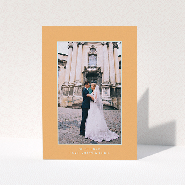 A wedding thank you card design called "Orange and blue". It is an A5 card in a portrait orientation. It is a photographic wedding thank you card with room for 1 photo. "Orange and blue" is available as a folded card, with tones of orange and blue.