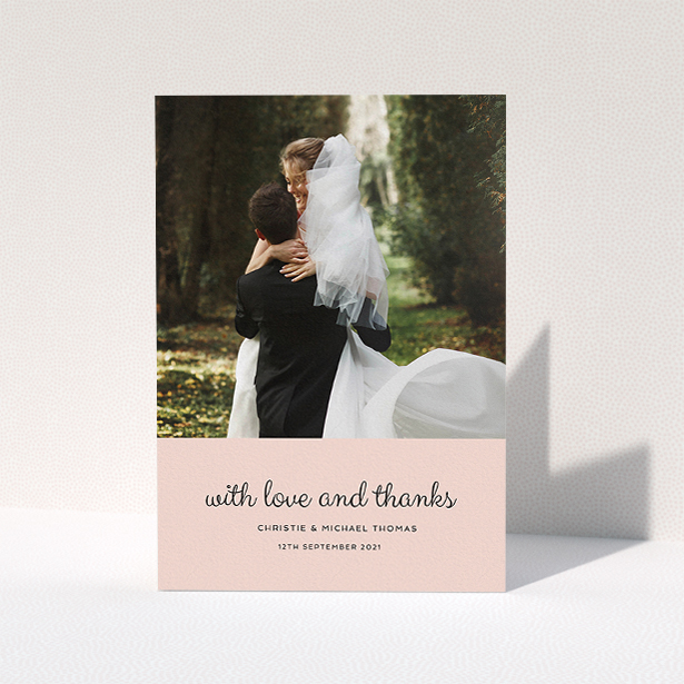 A wedding thank you card template titled "Pink Footer". It is an A5 card in a portrait orientation. It is a photographic wedding thank you card with room for 1 photo. "Pink Footer" is available as a folded card, with mainly pink colouring.