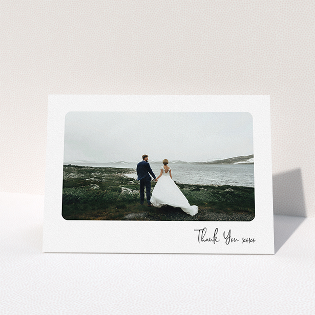 A wedding thank you card design called "Rounded Thanks". It is an A5 card in a landscape orientation. It is a photographic wedding thank you card with room for 1 photo. "Rounded Thanks" is available as a folded card, with mainly white colouring.