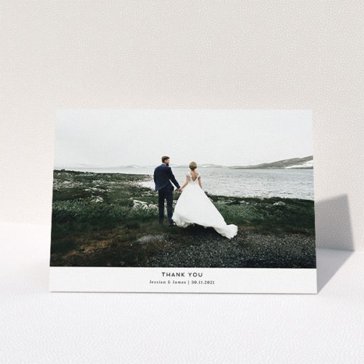 Wedding Thank You Card Design - "Sans Serif" A wedding thank you card named "Sans Serif". It is an A5 card in a landscape orientation. It is a photographic wedding thank you card with room for 1 photo. "Sans Serif" is available as a folded card, with mainly white colouring.