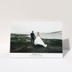 A wedding thank you card named "Sans Serif". It is an A5 card in a landscape orientation. It is a photographic wedding thank you card with room for 1 photo. "Sans Serif" is available as a folded card, with mainly white colouring.