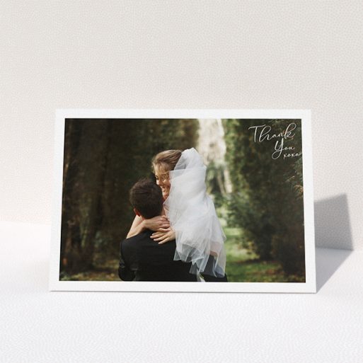 Wedding Thank You Card Design - "Simple Landscape Thanks" A wedding thank you card named "Simple Landscape Thanks". It is an A5 card in a landscape orientation. It is a photographic wedding thank you card with room for 1 photo. "Simple Landscape Thanks" is available as a folded card, with mainly white colouring.